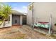 Enclosed side courtyard features pavers, a swing set and privacy fence at 4521 Tidal Pond Rd, New Port Richey, FL 34652