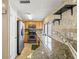 Well-lit kitchen with stainless steel appliances and granite countertops at 4521 Tidal Pond Rd, New Port Richey, FL 34652