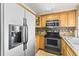 Bright kitchen features stainless steel appliances and ample counter space at 4521 Tidal Pond Rd, New Port Richey, FL 34652