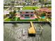 Lovely waterfront home with pool, private dock, brick patio, and manicured lawn at 4823 Arlington Rd, Palmetto, FL 34221