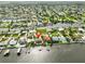 Waterfront property featuring a private dock, pool, and lush landscaping offers serene coastal living at 4823 Arlington Rd, Palmetto, FL 34221
