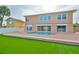 A beautiful backyard with synthetic lawn, brick patio, and private pool at 4823 Arlington Rd, Palmetto, FL 34221