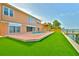Backyard featuring pool, brick patio, dock, canal access, and lush turf at 4823 Arlington Rd, Palmetto, FL 34221