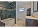 Elegant bathroom features dark green marble, tub, and stylish vanity at 4823 Arlington Rd, Palmetto, FL 34221