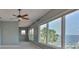 Bright bedroom featuring a ceiling fan and beautiful water views at 4823 Arlington Rd, Palmetto, FL 34221