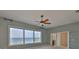 Bedroom with beautiful water views, a ceiling fan, and an attached bathroom for added convenience at 4823 Arlington Rd, Palmetto, FL 34221