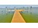 A spacious dock featuring boatlifts overlooking the beautiful open water view at 4823 Arlington Rd, Palmetto, FL 34221