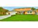 Charming two-story home with lush green lawn and well-maintained landscaping at 4823 Arlington Rd, Palmetto, FL 34221