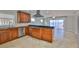 Gourmet kitchen with wooden cabinetry, stainless steel appliances, and granite countertops at 4823 Arlington Rd, Palmetto, FL 34221