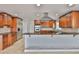 Spacious kitchen with stainless steel fridge, double ovens, and granite countertops at 4823 Arlington Rd, Palmetto, FL 34221