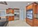Beautiful kitchen with stainless steel appliances, wood cabinets, and tile flooring at 4823 Arlington Rd, Palmetto, FL 34221