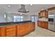 Well-appointed kitchen features granite countertops, stainless steel appliances, and water views at 4823 Arlington Rd, Palmetto, FL 34221