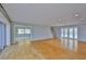 Spacious living room with wood floors, recessed lighting and view to other rooms at 4823 Arlington Rd, Palmetto, FL 34221