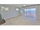 Spacious living room with sliding glass doors offering waterfront views at 4823 Arlington Rd, Palmetto, FL 34221