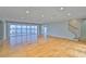 Bright living room features a wall of glass windows with water views and wood floors at 4823 Arlington Rd, Palmetto, FL 34221