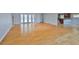 Open living area with wood floors, neutral paint and view to the kitchen at 4823 Arlington Rd, Palmetto, FL 34221