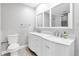 Elegant bathroom boasts dual sinks with marble countertop and modern fixtures at 5685 35Th N Ave, St Petersburg, FL 33710
