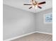 Bedroom with neutral walls and ceiling fan with light fixture at 5685 35Th N Ave, St Petersburg, FL 33710