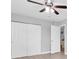 Spacious bedroom featuring a ceiling fan and convenient closet access at 5685 35Th N Ave, St Petersburg, FL 33710
