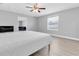 Serene bedroom with light-colored walls, wood floors, a ceiling fan, and ample natural light at 5685 35Th N Ave, St Petersburg, FL 33710