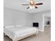 Bright bedroom offers light wood floors, and a ceiling fan at 5685 35Th N Ave, St Petersburg, FL 33710