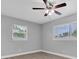 Inviting bedroom with large windows allowing ample natural light and modern ceiling fan at 5685 35Th N Ave, St Petersburg, FL 33710
