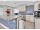 Well-appointed kitchen featuring granite countertops, tile backsplash, and stainless-steel appliances at 5685 35Th N Ave, St Petersburg, FL 33710