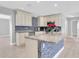 Modern kitchen with granite countertops, stainless steel appliances, and ample cabinet space at 5685 35Th N Ave, St Petersburg, FL 33710