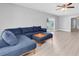 Spacious living room with a comfortable sectional sofa and sliding glass doors to the backyard at 5685 35Th N Ave, St Petersburg, FL 33710