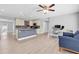 Open-concept living with a kitchen island, workspace, and comfortable seating area at 5685 35Th N Ave, St Petersburg, FL 33710