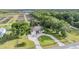 Lovely aerial view of the residence and the surrounding manicured grounds with mature trees at 6411 Barton Rd, Plant City, FL 33565