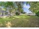 Spacious backyard with pool, shed, and lush landscaping at 6411 Barton Rd, Plant City, FL 33565