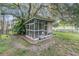 Backyard chicken coop shaded by mature trees in the yard at 6411 Barton Rd, Plant City, FL 33565