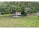 Chicken coop in backyard with mature trees surrounding it at 6411 Barton Rd, Plant City, FL 33565