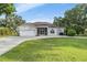 Charming single-story home with a well-manicured lawn and driveway at 6411 Barton Rd, Plant City, FL 33565