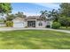 Charming single-story home with a well-manicured lawn and driveway at 6411 Barton Rd, Plant City, FL 33565