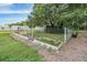Backyard raised garden beds with a variety of herbs and vegetable plants near the wooded area of the property at 6411 Barton Rd, Plant City, FL 33565