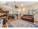 Open-concept living area with hardwood floors connecting the kitchen, dining, and living spaces at 6411 Barton Rd, Plant City, FL 33565