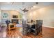 Cozy living room featuring a fireplace, hardwood floors, built-in shelving, and ample natural light at 6411 Barton Rd, Plant City, FL 33565