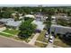 Aerial view of a neighborhood showcasing tidy landscaping and the home's location at 6551 S West Shore Cir, Tampa, FL 33616