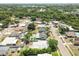 This aerial view showcases homes with private pools, sheds and lush landscaping, along quiet streets at 6551 S West Shore Cir, Tampa, FL 33616