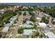 This aerial view captures a residential neighborhood with mature trees and various home styles at 6551 S West Shore Cir, Tampa, FL 33616