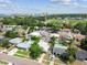 Enjoy the serene neighborhood from above, with lush greenery, beautiful homes, and a glimpse of the nearby bay at 6551 S West Shore Cir, Tampa, FL 33616