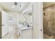 Elegant bathroom featuring a double vanity, stylish shower, and neutral color palette at 6551 S West Shore Cir, Tampa, FL 33616
