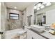 Bathroom with tub/shower combo, vessel sink, and updated fixtures at 6551 S West Shore Cir, Tampa, FL 33616