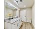 Bathroom with a double sink vanity, granite countertops, and modern finishes at 6551 S West Shore Cir, Tampa, FL 33616