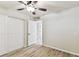 Light and airy bedroom with ceiling fan and wood-look floors at 6551 S West Shore Cir, Tampa, FL 33616