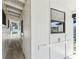 Side view of a white home, showcasing a walkway and architectural details at 6551 S West Shore Cir, Tampa, FL 33616