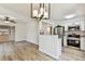 Inviting kitchen with stainless steel appliances, white cabinets, and modern lighting at 6551 S West Shore Cir, Tampa, FL 33616