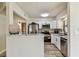 Modern kitchen with stainless steel appliances and white cabinetry at 6551 S West Shore Cir, Tampa, FL 33616